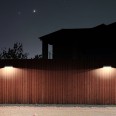 800-lumen solar-powered LED wall light with motion detector. White.